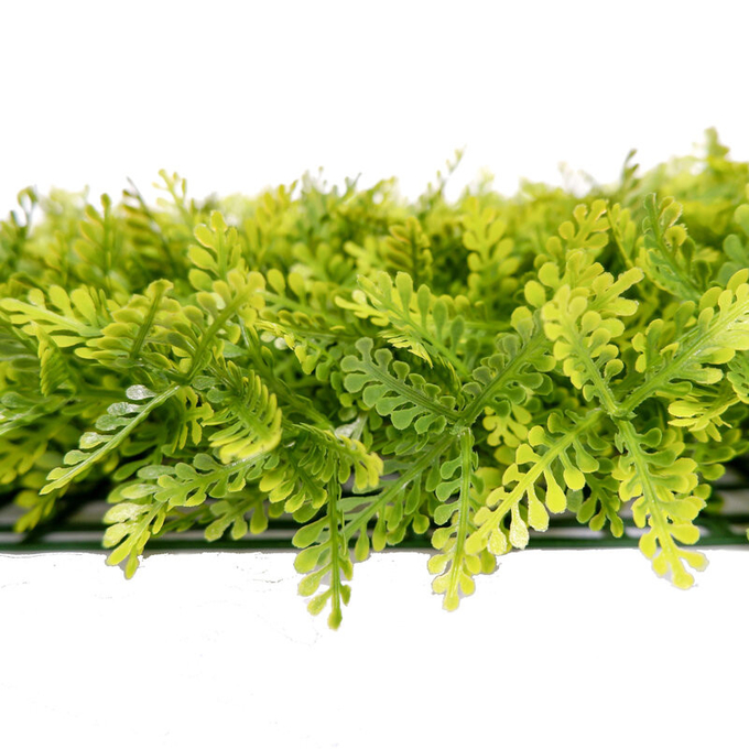 Plantas artificiais das folhas verdes decorativas verdes artificiais de tapeçaria